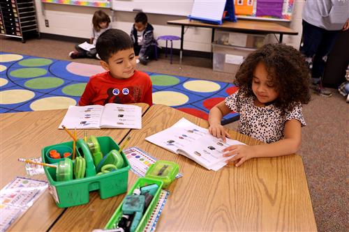 students reading a book